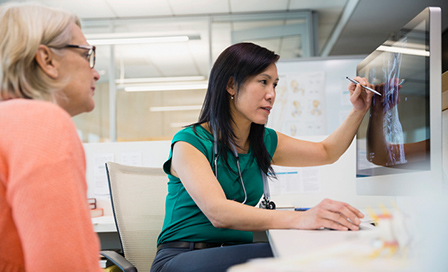 Doctor discussing the result of an MRI with a patient