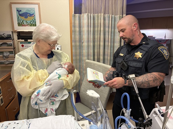 Police lieutenant son and his mother, a nurse, connect for NICU read-a-thon