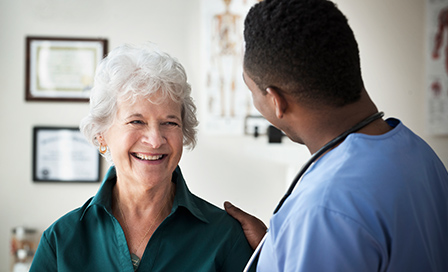 Nurse talking to patient in clinic