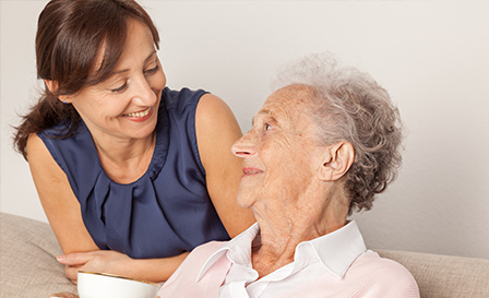 Senior woman with her home caregiver