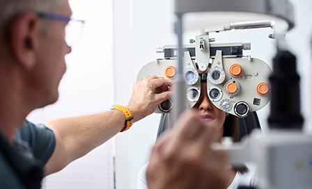 Optometrist calibrating his phoropter. 